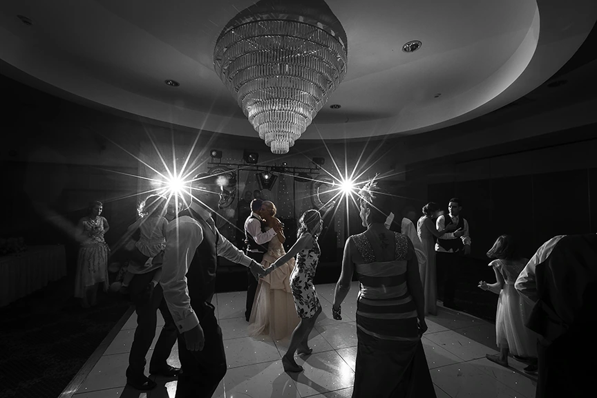 Lady puller her partner on to a crowded dance floor LaMon House Hotel Belfast